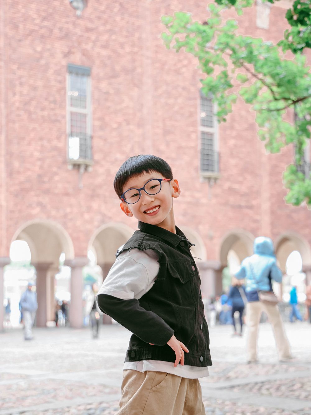 A boy posing proudly on the city hall square